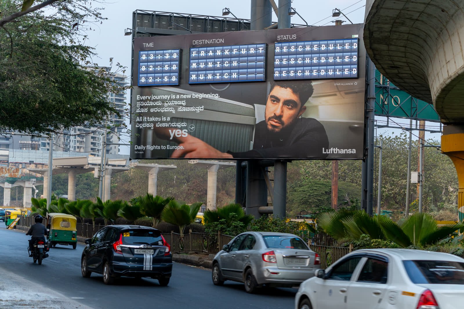 Large roadside hoarding at Hebbal in morning traffic